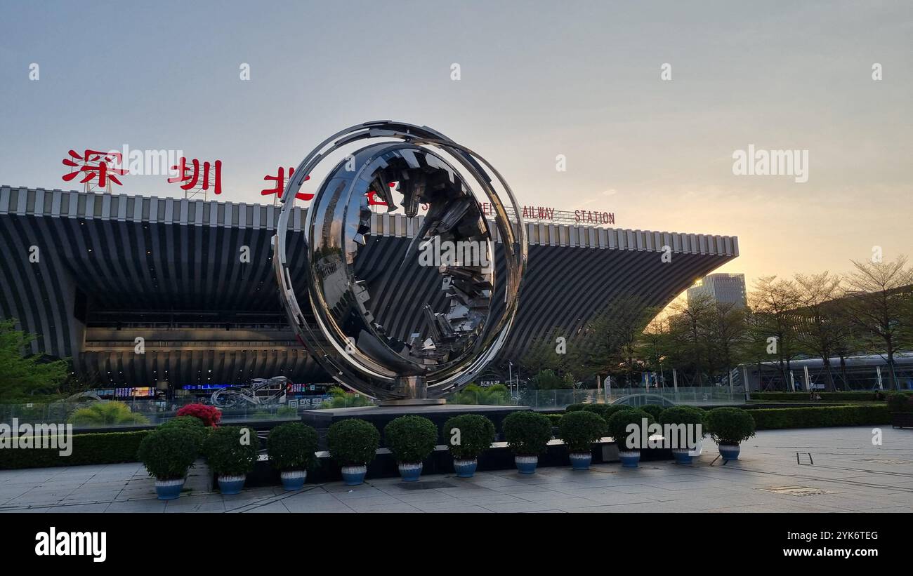 The image captures Shenzhen North (Shenzhen Bei) High-Speed Railway Station, a modern and iconic landmark in Shenzhen, China. - Smartphone Captured Stock Image