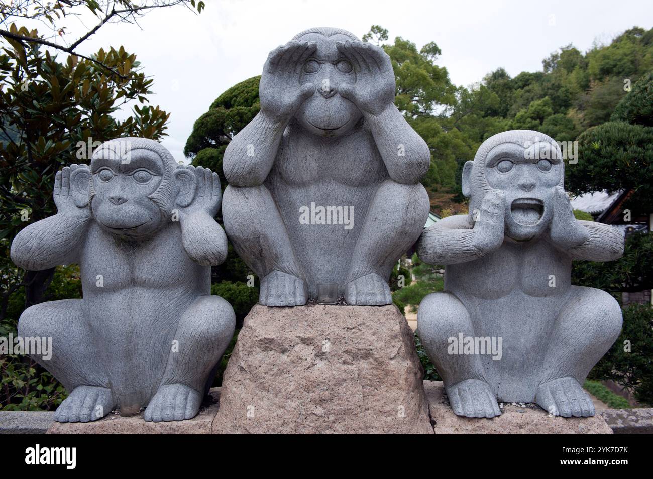 Hear evil, see evil and speak evil monkey statues the opposite of the mythological hear no evil, see no evil and speak no evil, in Onomichi, Japan Stock Photo