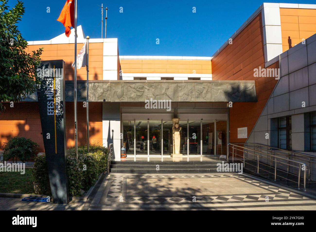 Selçuk, İzmir – TR – Oct 21, 2024 The Ephesus Museum entrance features a modern facade with an orange and gray color scheme, a statue centerpiece, and Stock Photo