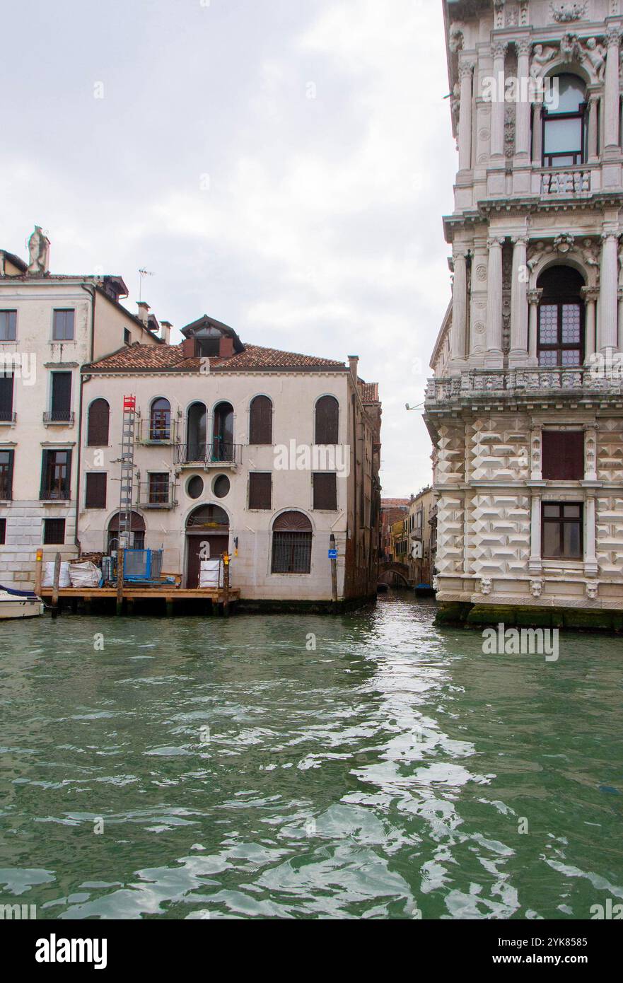 A view of historic Venetian buildings along the Grand Canal, showcasing ...