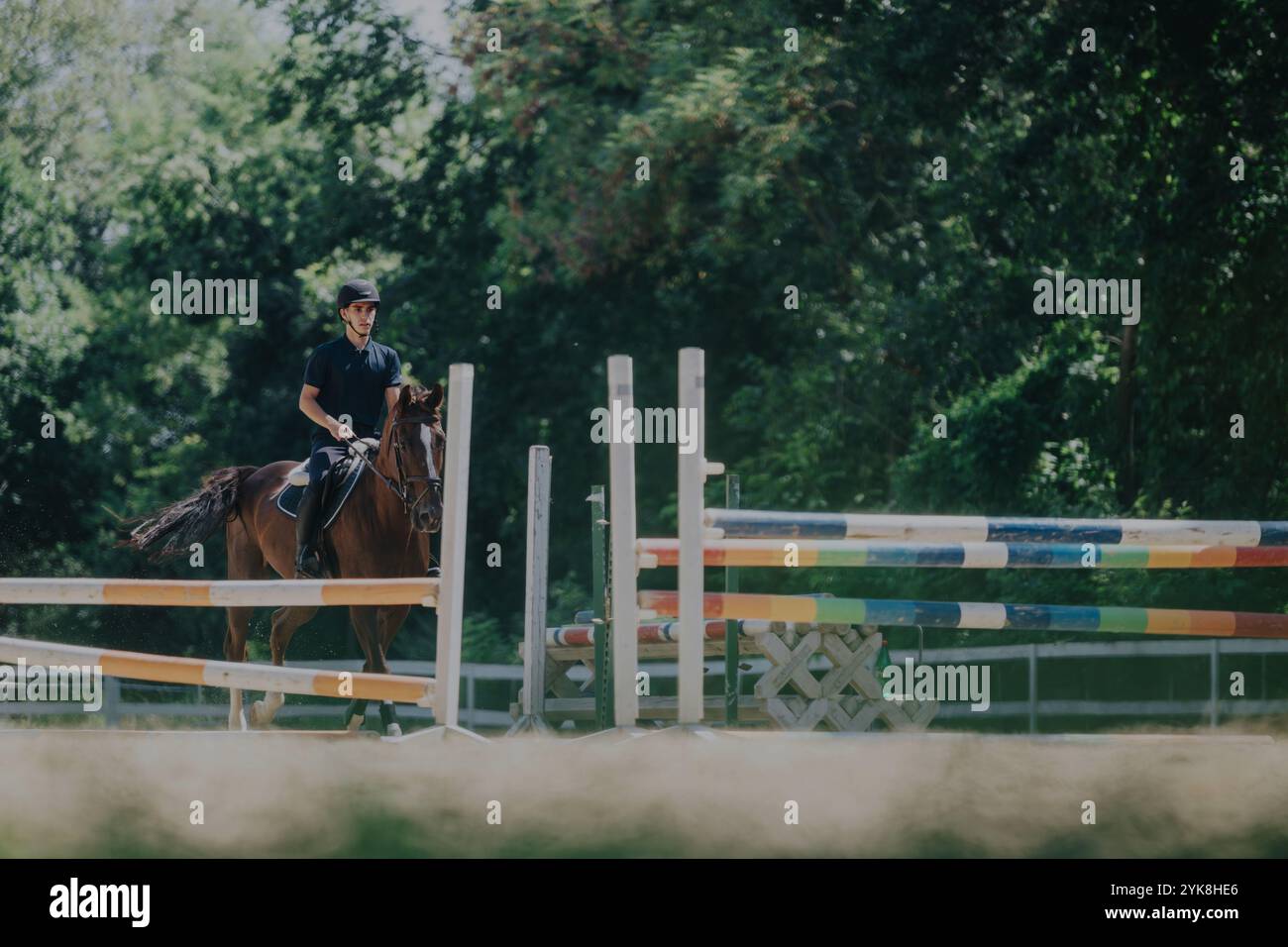 Equestrian jumping competition with rider and horse outdoors Stock ...