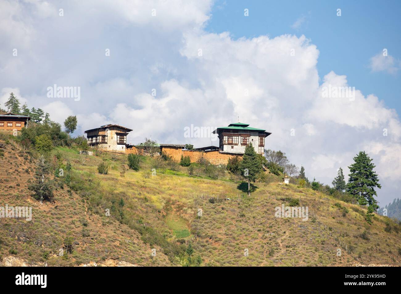 Traditional Bhutanese building complex nestled on a hillside, Paro, Bhutan. Stock Photo