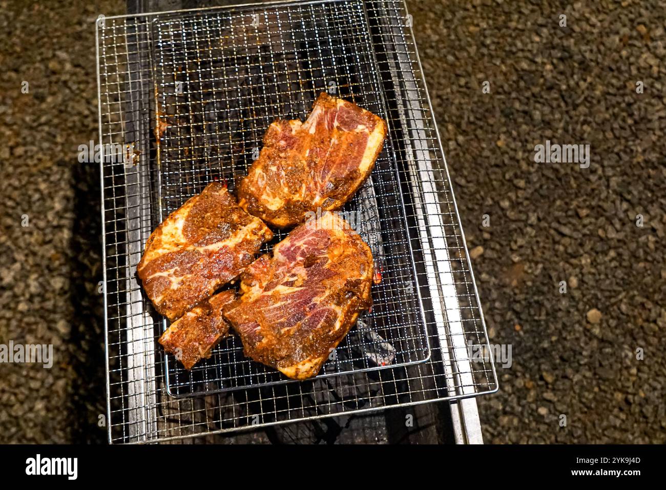 Meat on a barbecue charcoal grill Stock Photo - Alamy