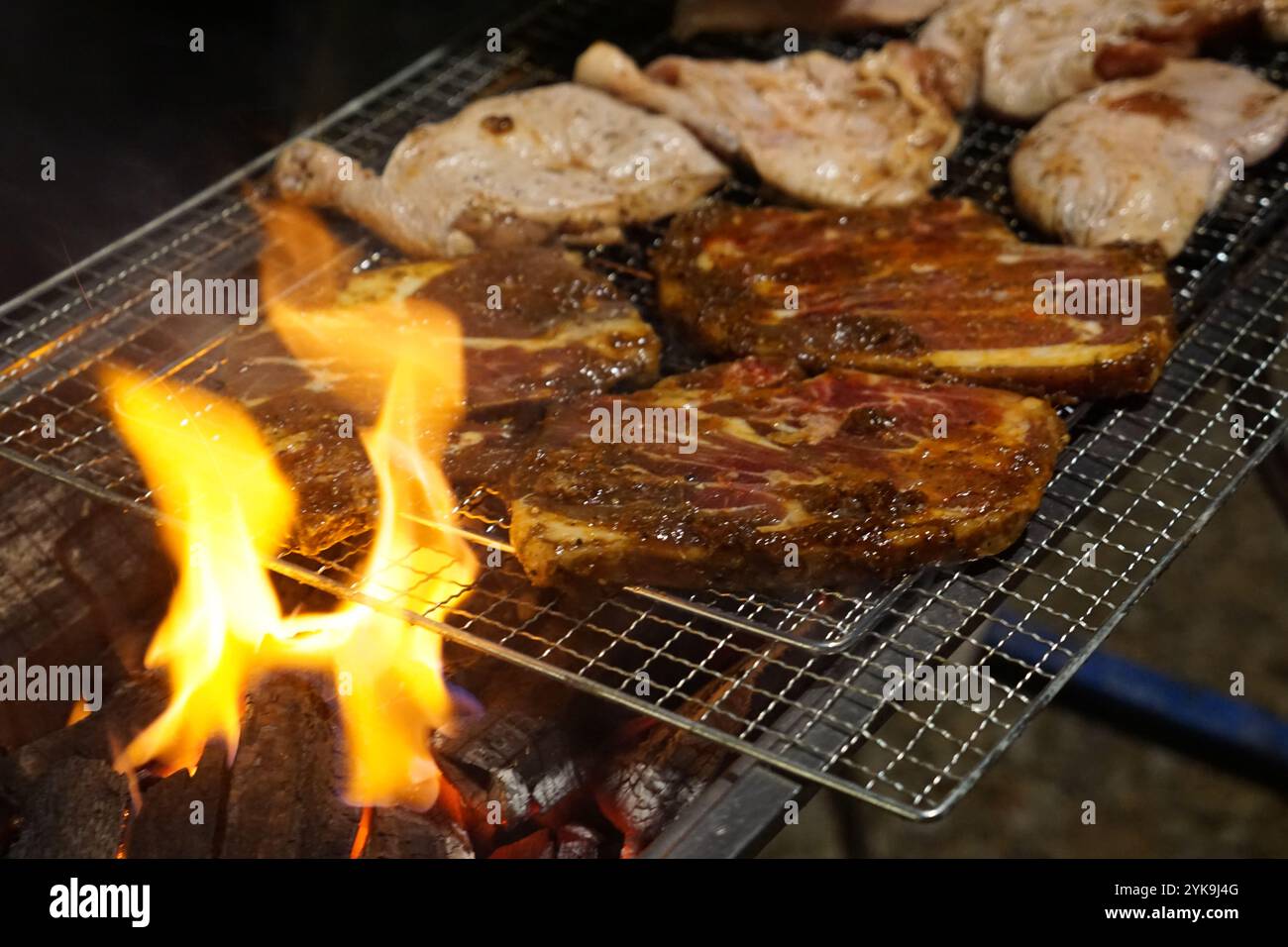 Meat on a barbecue charcoal grill Stock Photo - Alamy