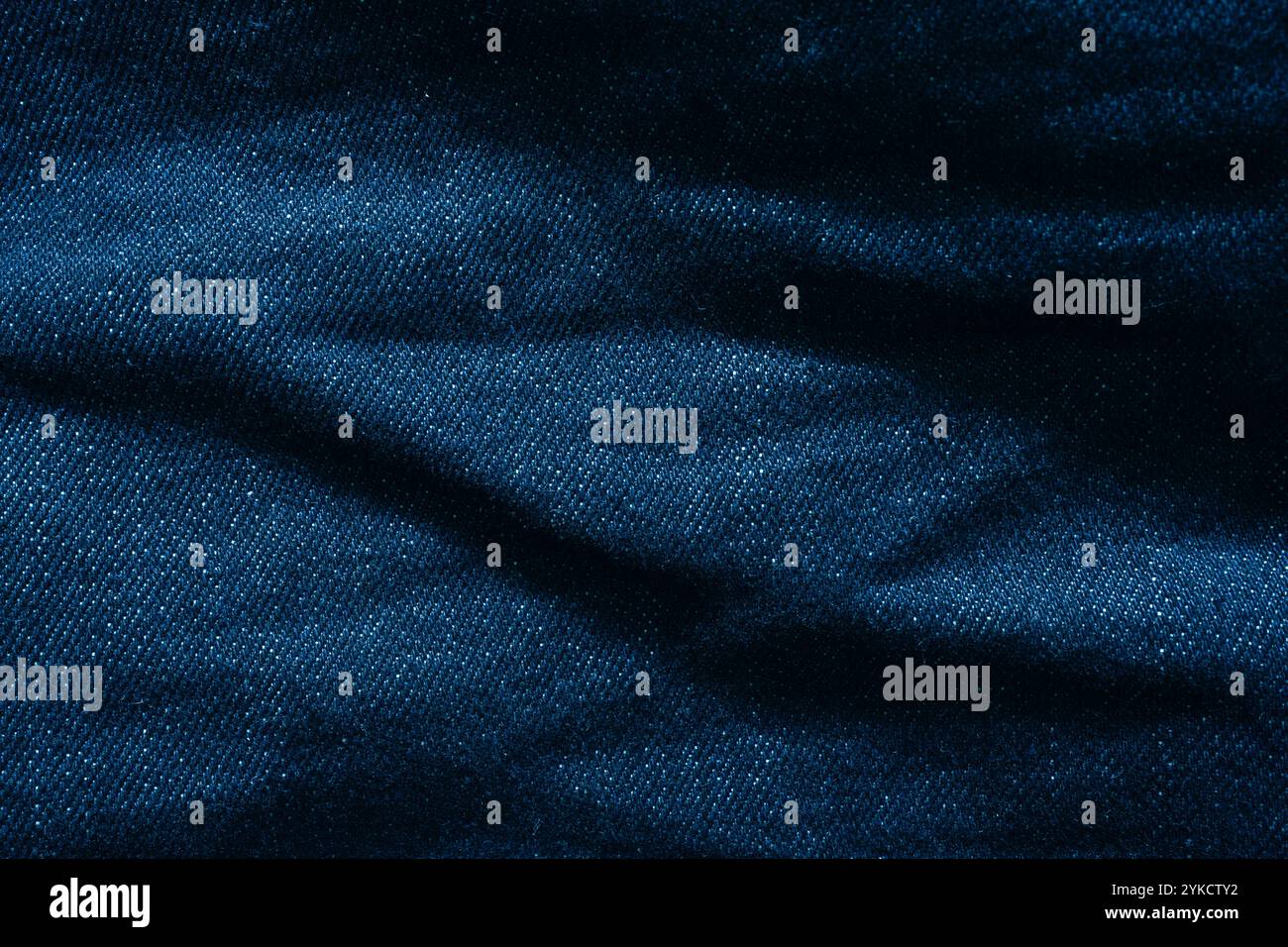 Crumpled jeans fabric texture background Stock Photo