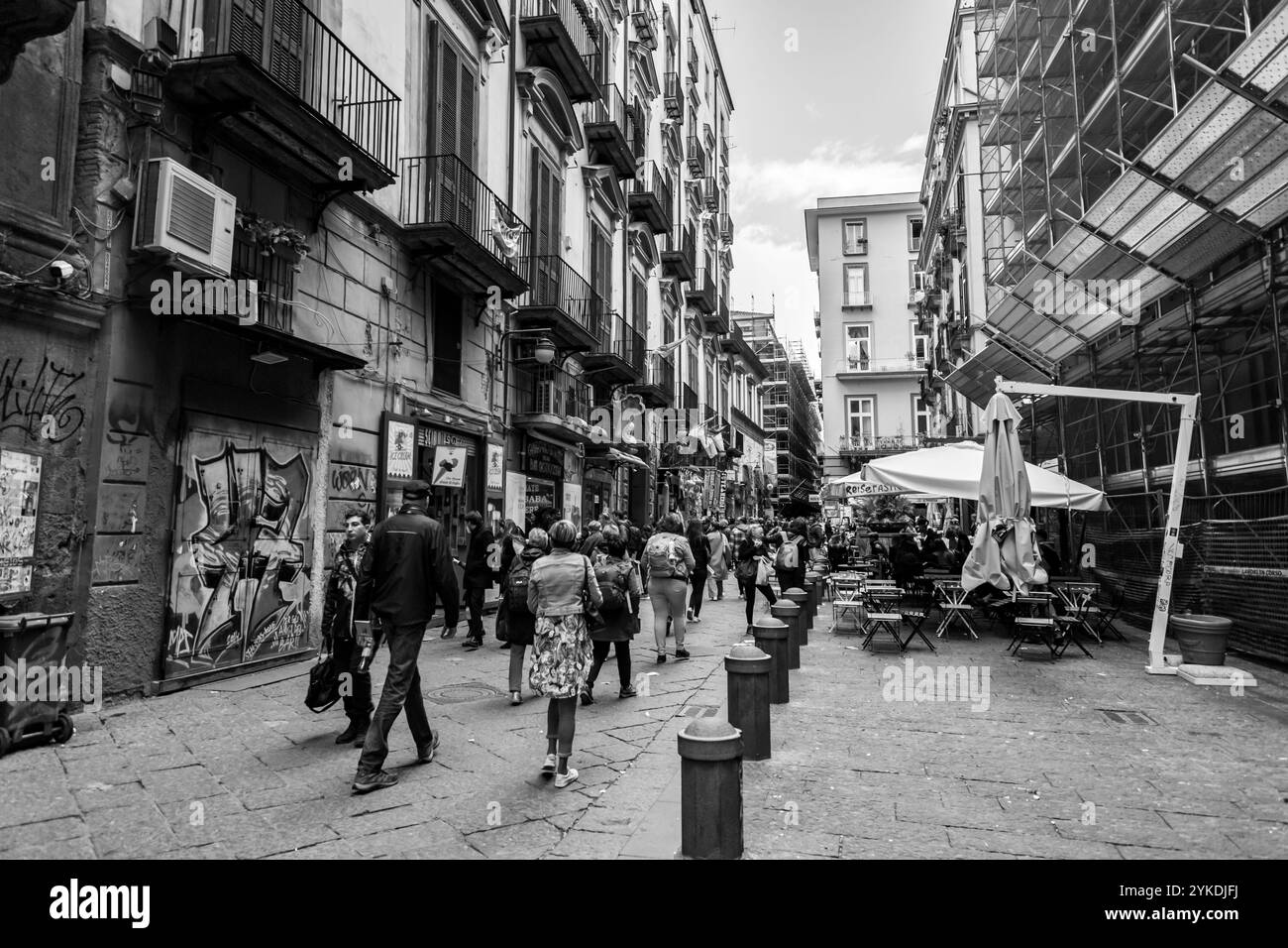 Naples, Italy - April 10, 2022: Spaccanapoli is the straight and narrow main street that traverses the old, historic center of the city of Naples, Ita Stock Photo