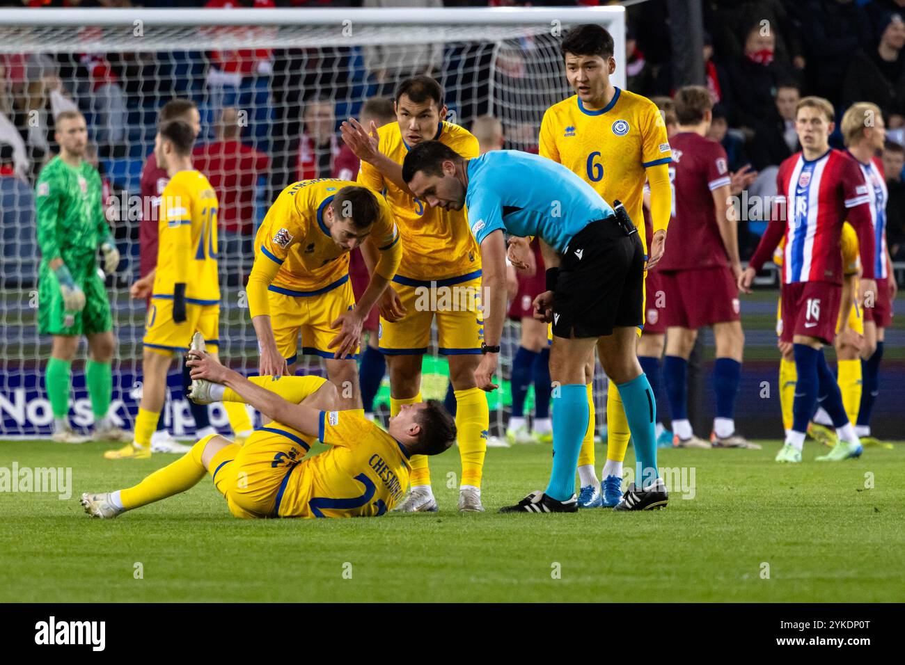 Oslo, Norway. 17th Nov, 2024. Referee Jasper Vergoote is checking up on Islam Chesnokov (23) of Kazakhstan during the UEFA Nations League match between Norway and Kazakhstan at Ullevaal Stadion in Oslo. Credit: Gonzales Photo/Alamy Live News Stock Photo