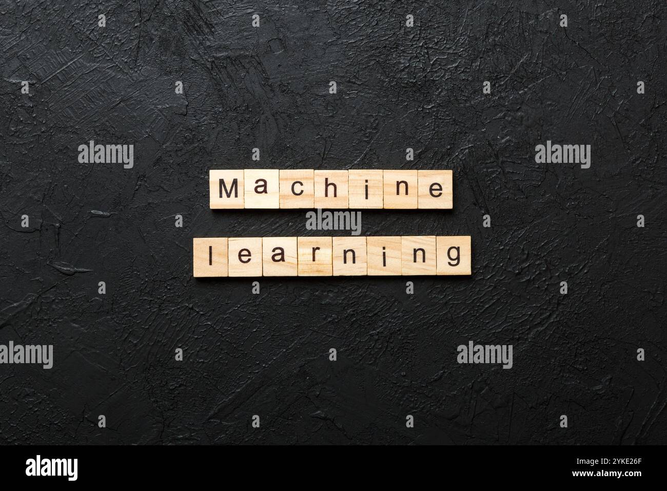 Machine learning word written on wood block. Machine learning text on ...