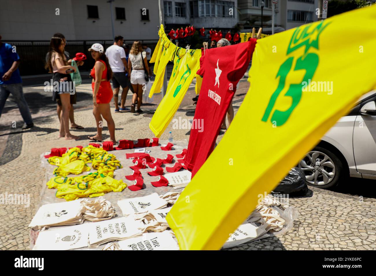 Rio De Janeiro, Brazil. 06th Nov, 2022. Street vendors sell pro-Lula merchandise on the Copacabana boardwalk during a carnival organized to celebrate the president-elect. Supporters of Luiz Inácio Lula da Silva, known as Lula, took to the waterfront of Copacabana, Rio de Janeiro, to celebrate the left-wing president-elect's victory on October 30, 2022. In a Carnival block, several people in costume, some on stilts, danced to the sound of carnival instruments. (Photo by Apolline Guillerot-Malick/SOPA Images/Sipa USA) Credit: Sipa USA/Alamy Live News Stock Photo