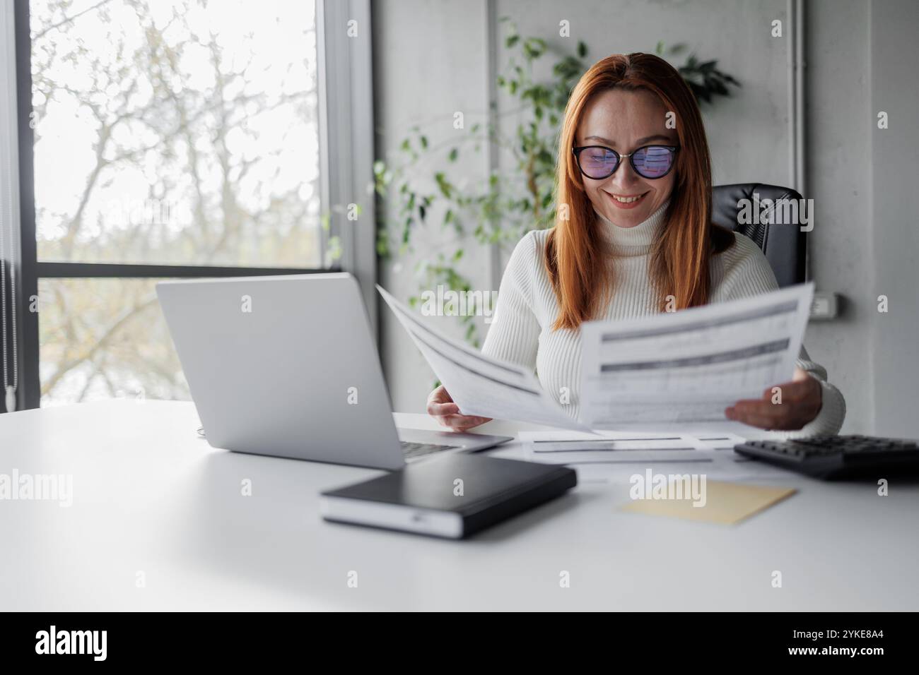 Businesswoman Analyzing Documents Stock Photo