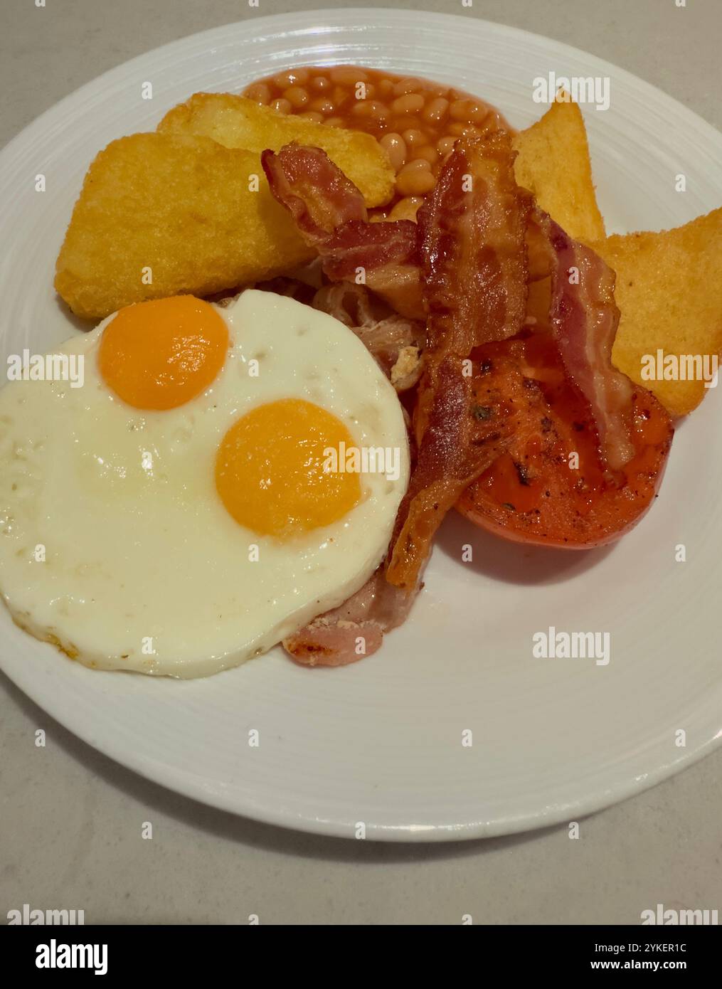 Traditional fried breakfast on white plate - Smartphone Captured Stock Image