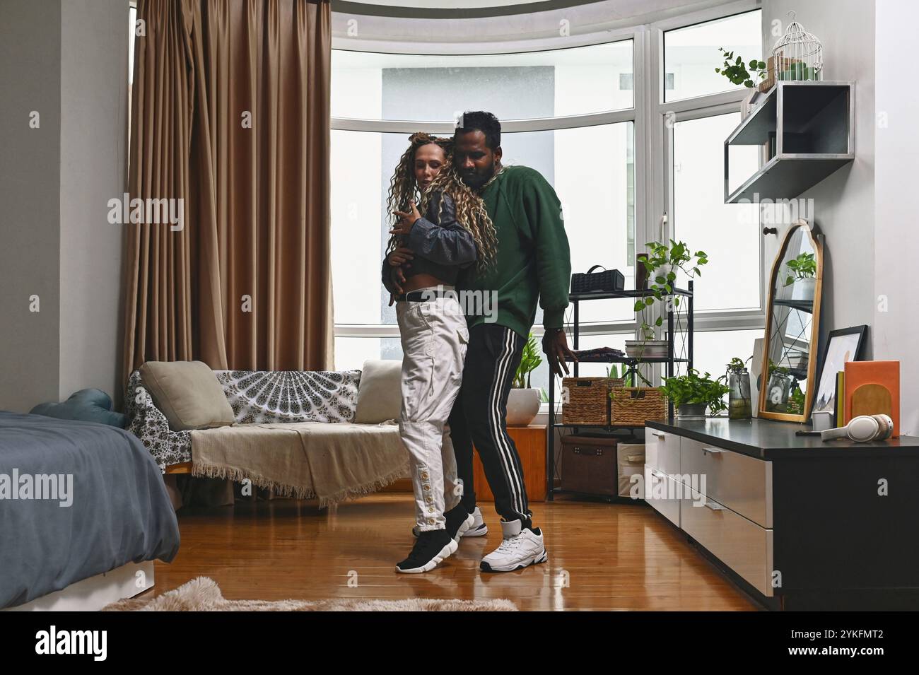 Young Couple Practicing Dance At Home Stock Photo