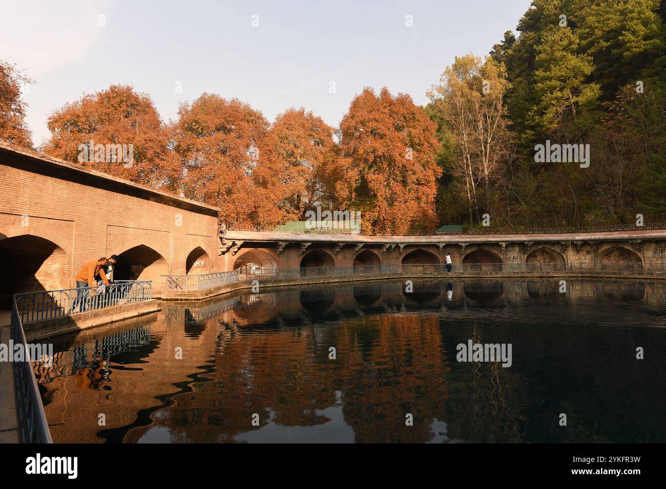 Anantnag, Jammu And Kashmir, India. 18th Nov, 2024. Visitors walk near the Verinag spring on an autumn day, about 85kms south-east of Srinagar, the summer capital of Jammu & Kashmir. Autumn, locally known as Harud, is a season of harvesting in Kashmir with trees changing their colours while the day light hours become shorter as winter approaches. (Credit Image: © Basit Zargar/ZUMA Press Wire) EDITORIAL USAGE ONLY! Not for Commercial USAGE! Stock Photo