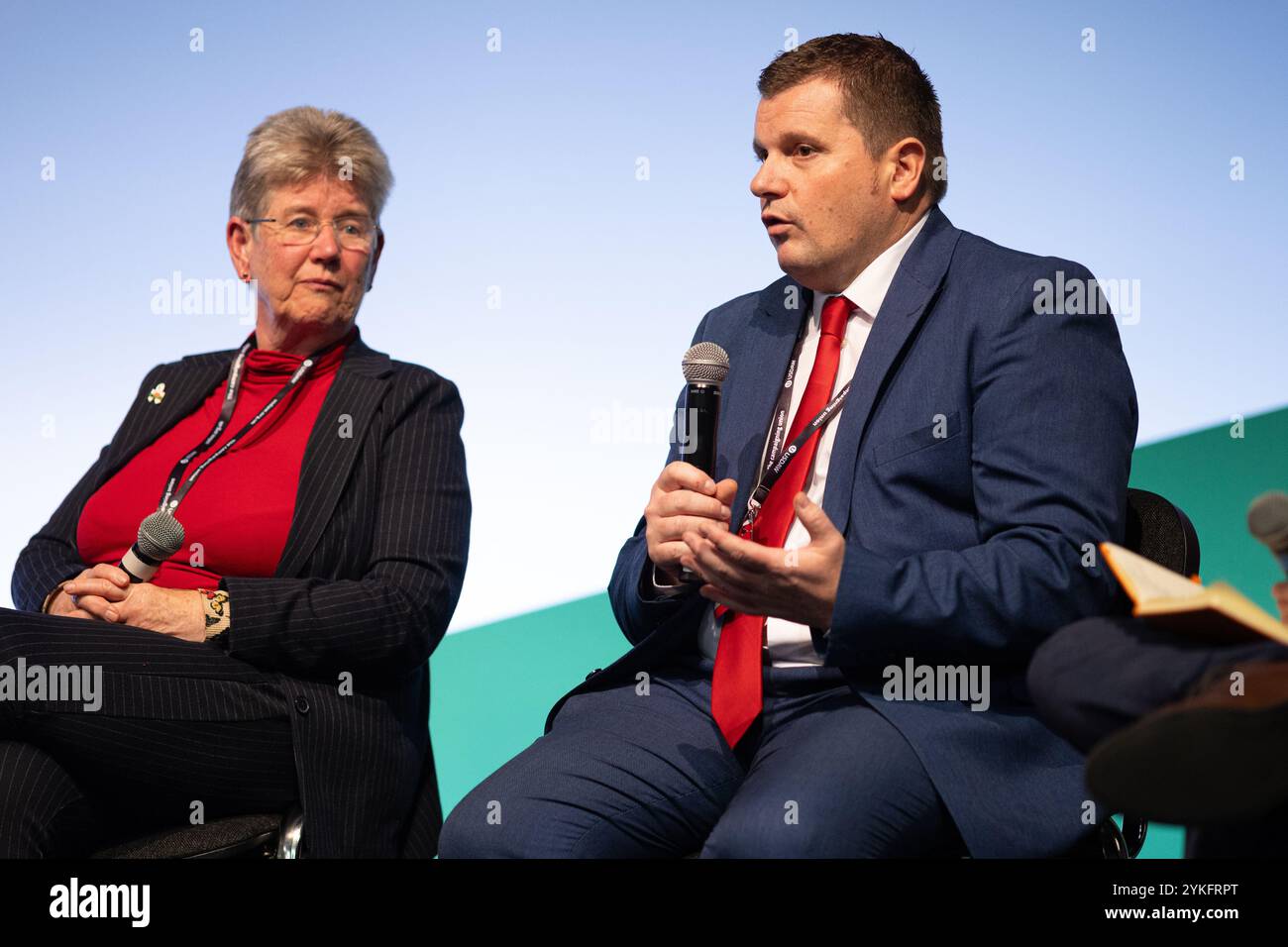 Llandudno, Wales, UK. 16th Nov 2024. Cllr Andrew Morgan OBE, Leader of Rhondda Cynon Taff Council, and leader of the WLGA speaks on a panel at Welsh Labour Conference, Jane Hutt MS, Cabinet Secretary for Social Justice is seated next to him. Sean Pursey/Alamy Live News Stock Photo