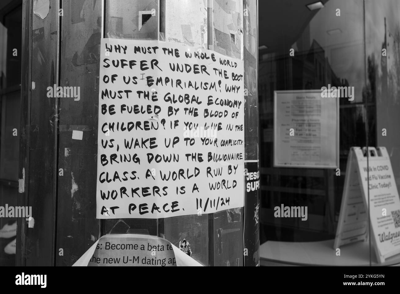 A handwritten sign in protest of American imperialism and the billionaire class, in Ann Arbor Michigan USA Stock Photo