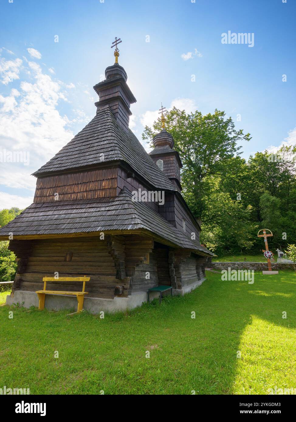 likitsary, transcarpathia, ukraine - jul 02, 2020: st. vasyl wooden church in carpathian mountains. vintage temple. sunny summer day. countryside desi Stock Photo