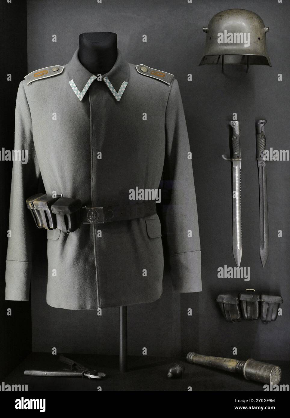 World War I (1914-1918). German Empire (1871-1918). From left to right, top to bottom: soldier's uniform tunic of German Army Bavarian Stormtrooper units, German Army wire cutters, German army helmet M16, bayonets M98/05 with and without removed saw-back (Germany), German Army soldiers' ammunition pouch and hand grenade M1917 'Stielhandgranate 17' ('potato masher'), Germany. Latvian War Museum. Riga. Latvia. Stock Photo