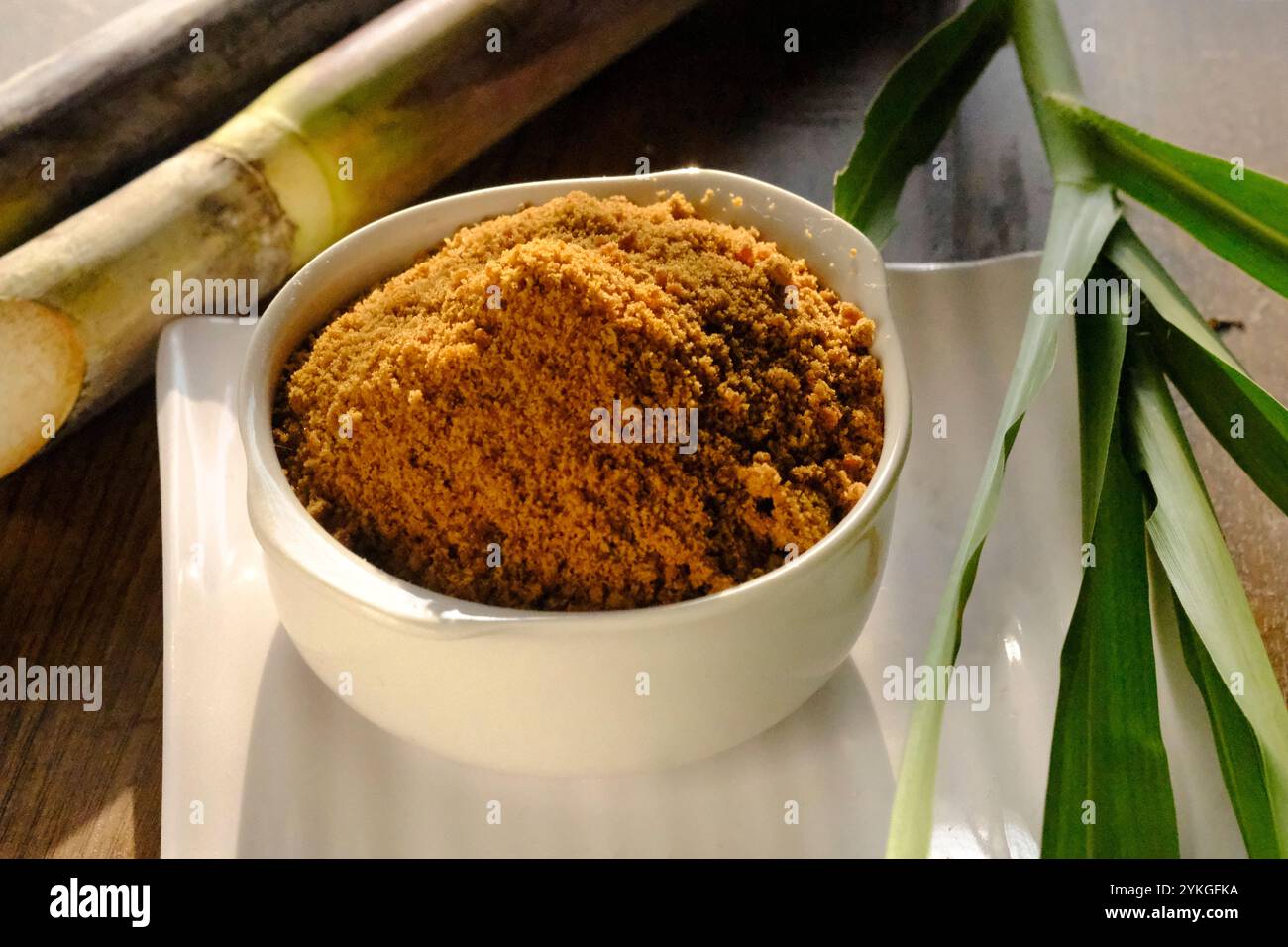 Jaggery powder with jaggery cubes. Jaggery is used as an ingredient in ...