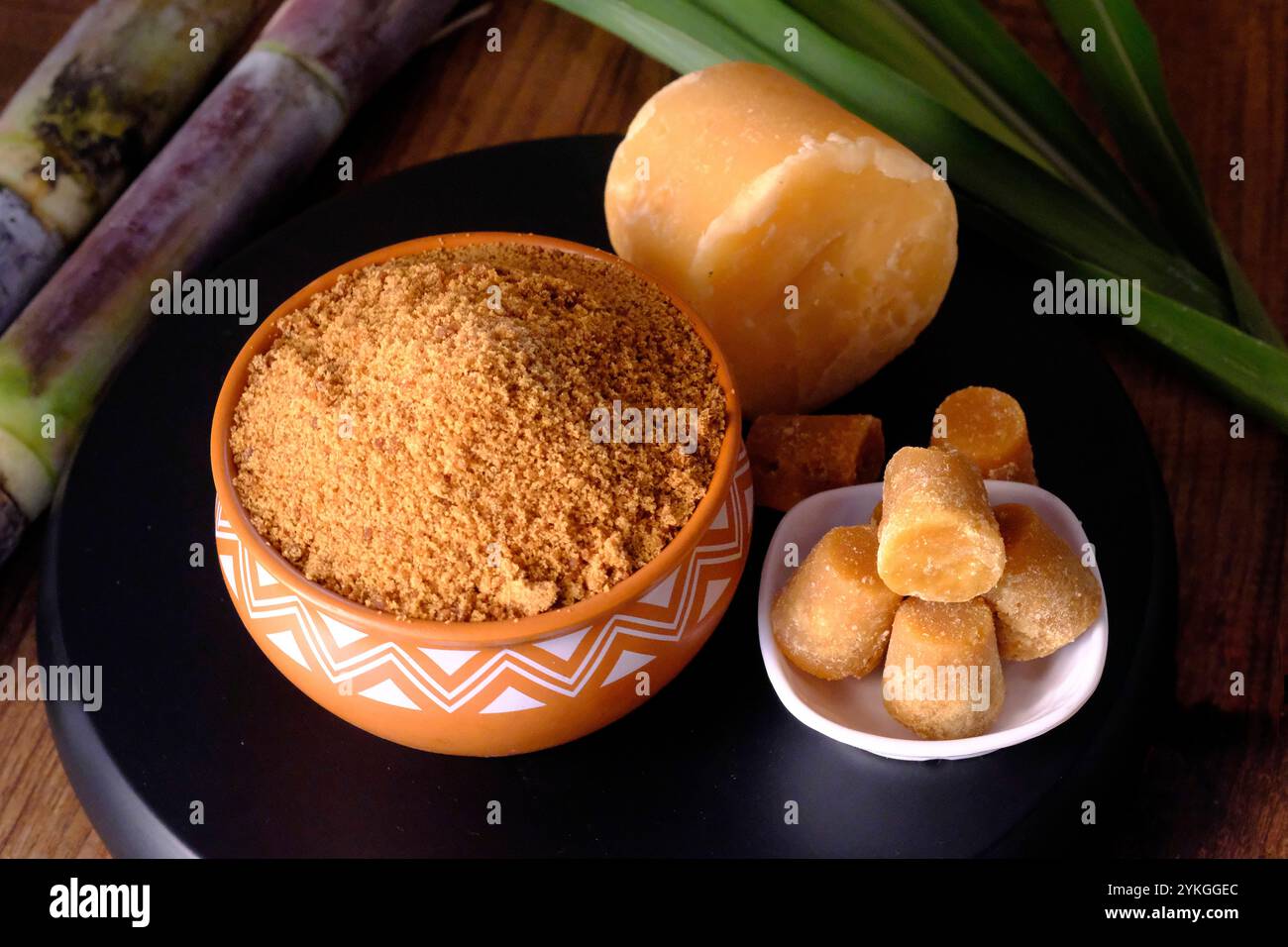 Jaggery powder with jaggery cubes. Jaggery is used as an ingredient in ...