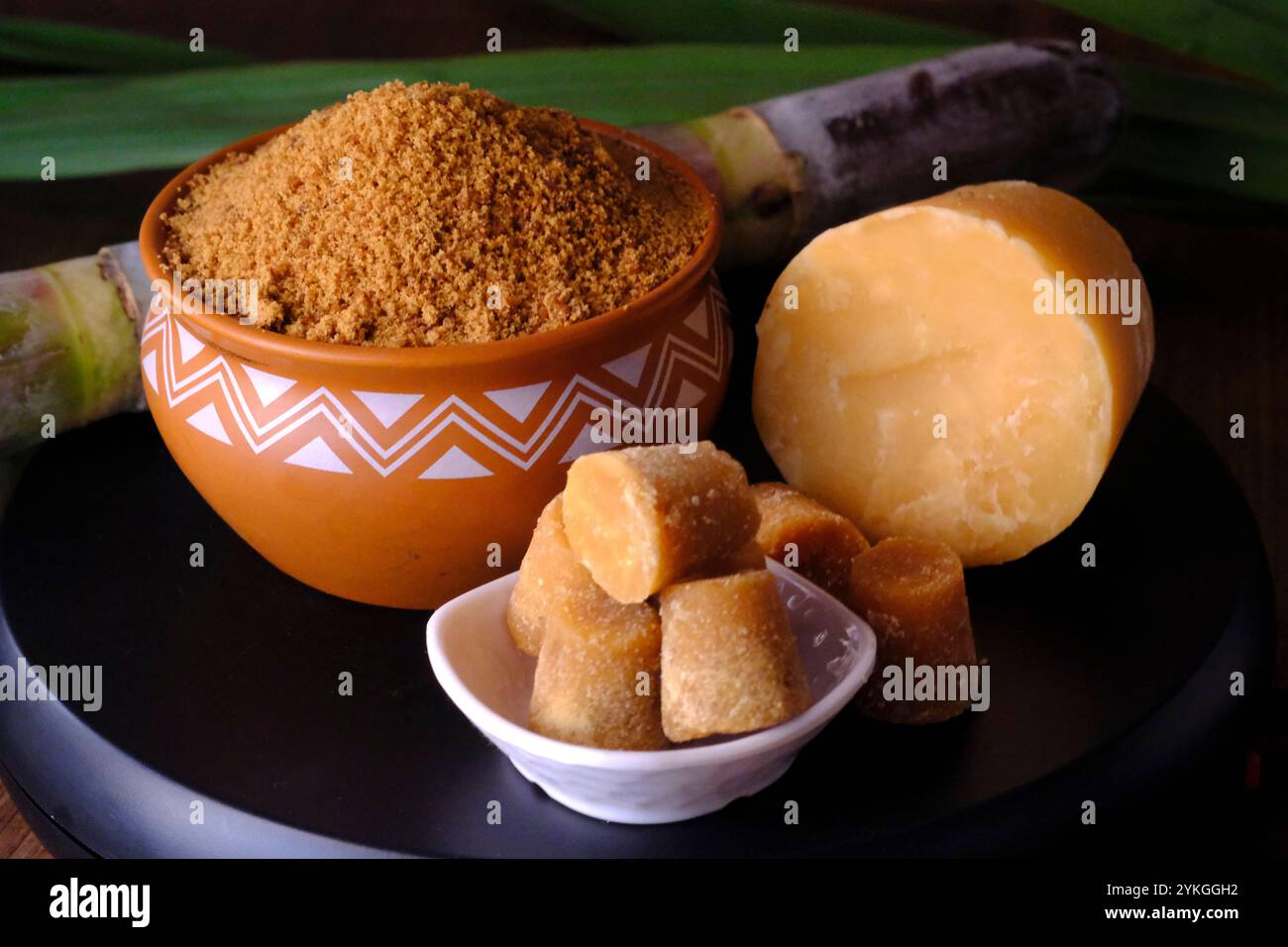 Jaggery powder with jaggery cubes. Jaggery is used as an ingredient in ...