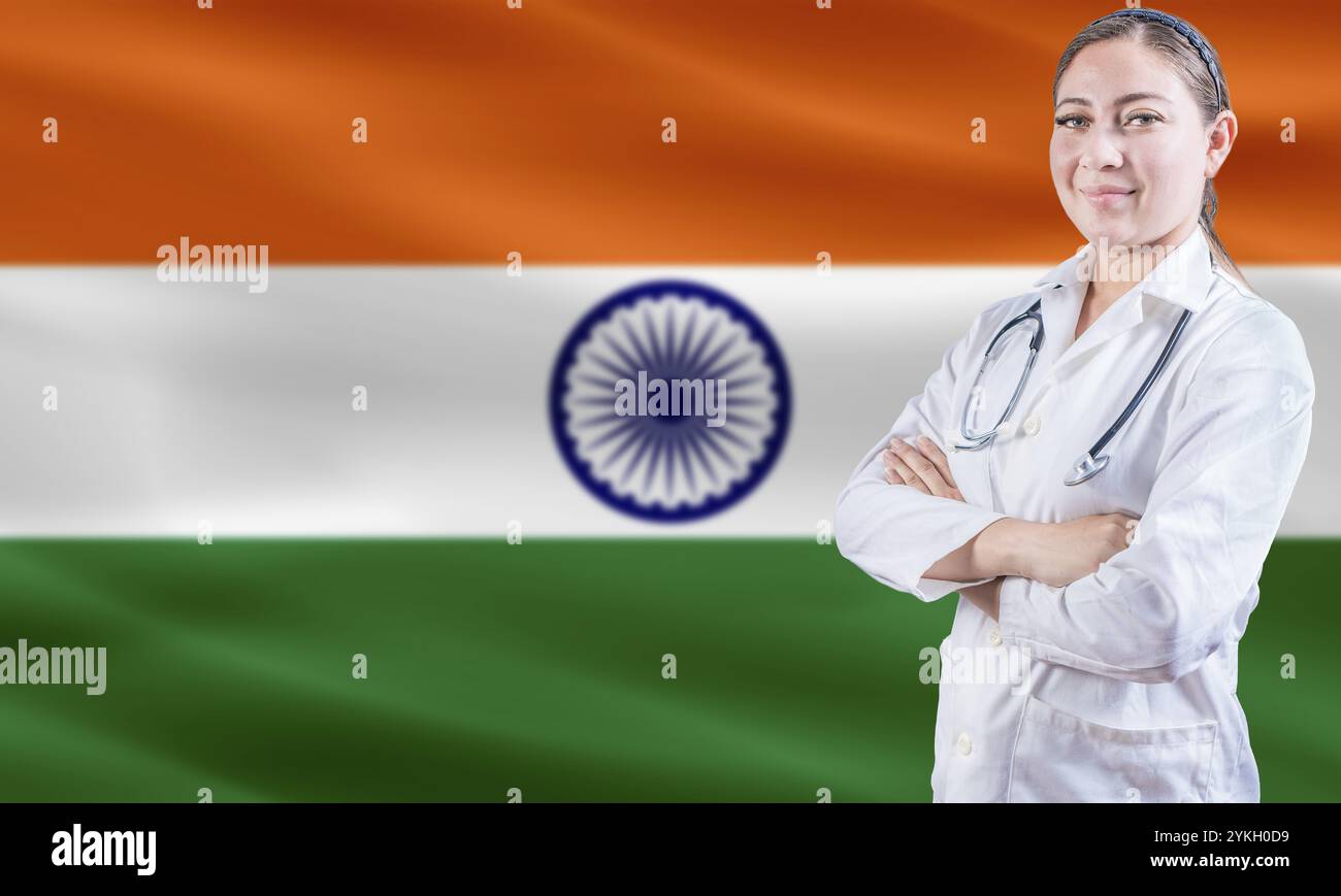 Female doctor on India flag. Doctor with crossed arms on India flag. India Health and Care concept Stock Photo