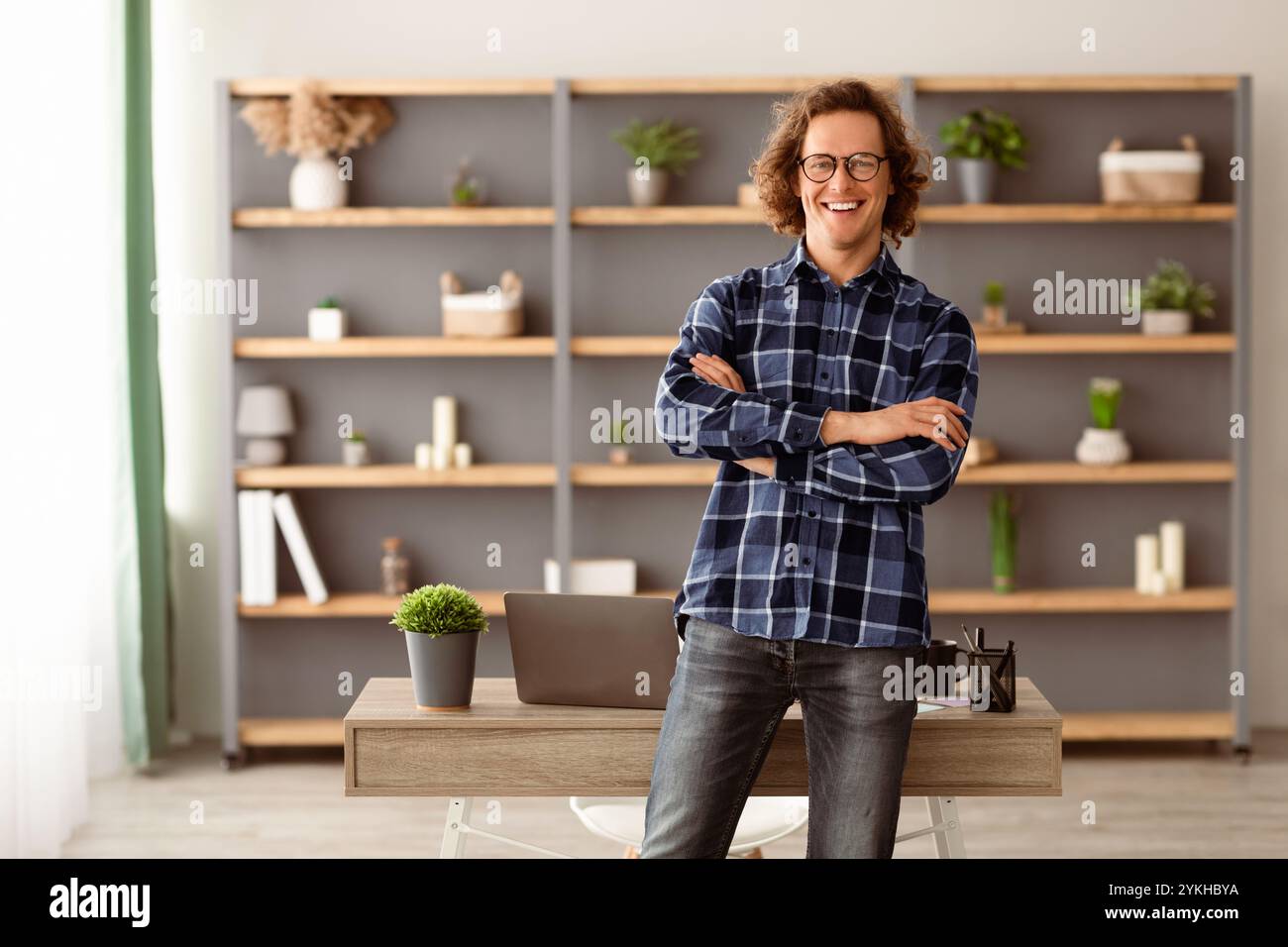 Happy Freelancer Hipster Guy Standing Posing In Modern Office Stock Photo