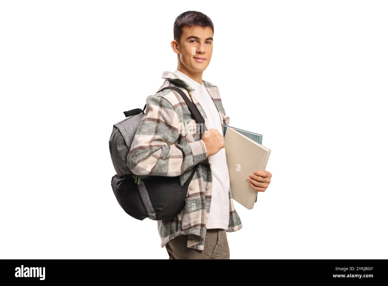 Male student with backpack and books standing and smiling at camera ...