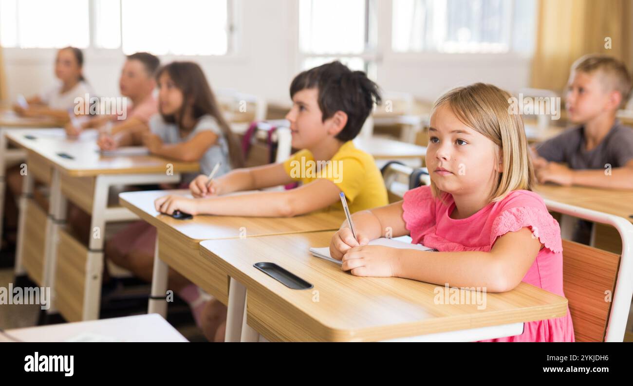 Schoolchildren in classroom Stock Photo - Alamy