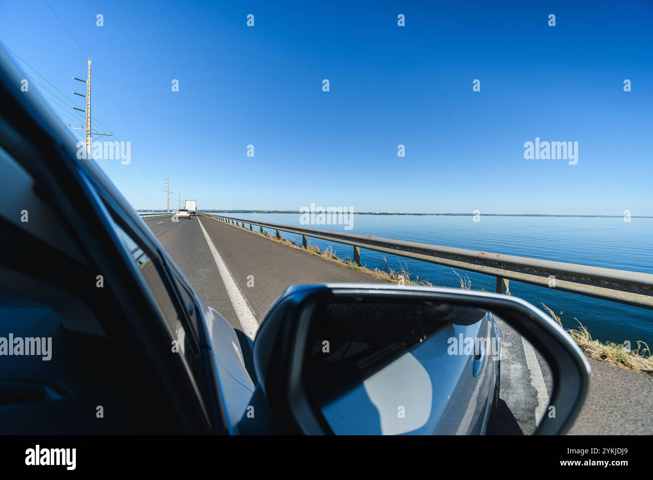 Driving the car on the Helio Serejo bridge, over the Parana river, on the BR-267 highway. Bridge that divides the states of Mato Grosso do Sul and Sao Stock Photo