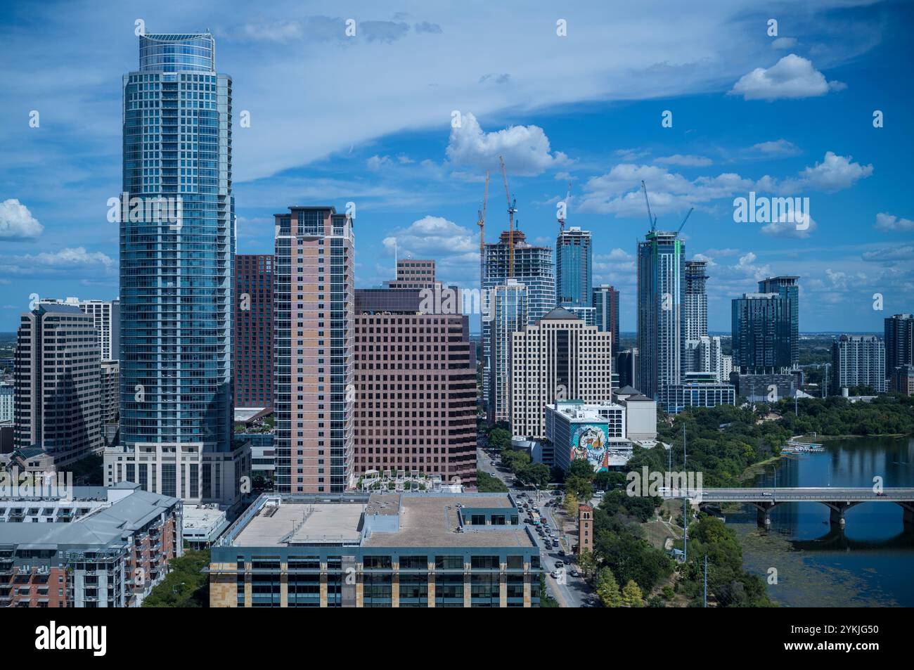 Austin Texas skyline with new construction on Rainey Street and cumulus clouds in blue sky. Stock Photo