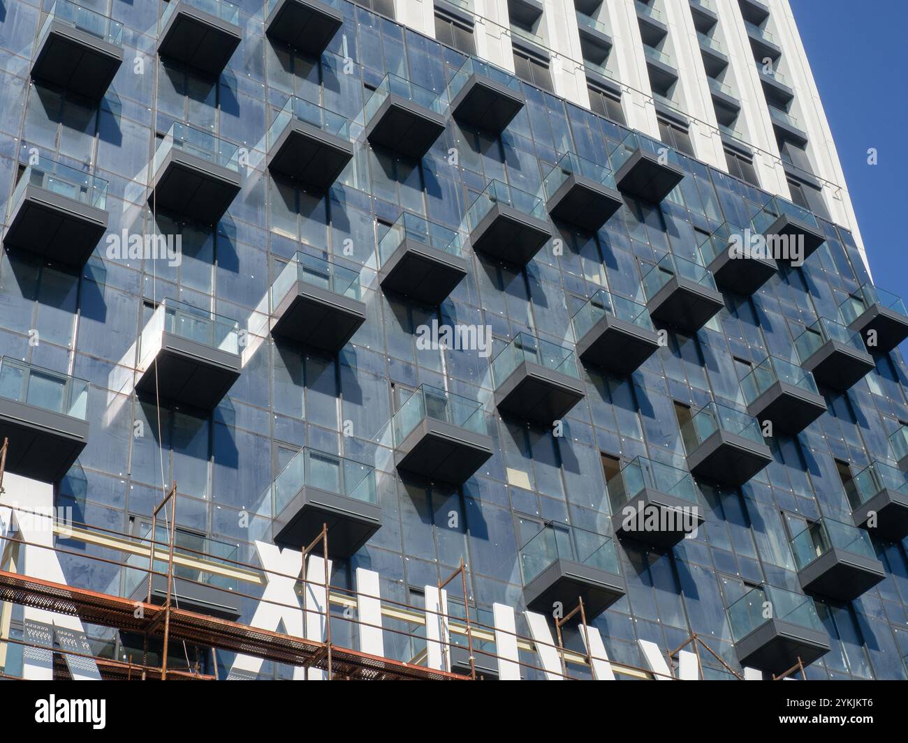 Facade of a modern multi-storey building. Balconies of a high-rise ...