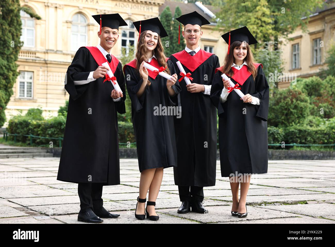 After Graduation Image Happy students with diplomas after graduation ceremony outdoors Stock ...