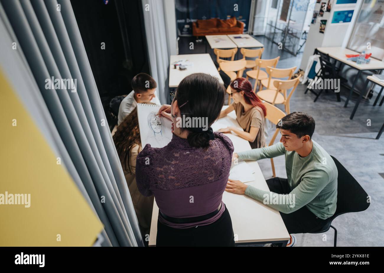 Creative art class with students drawing in studio setting Stock Photo