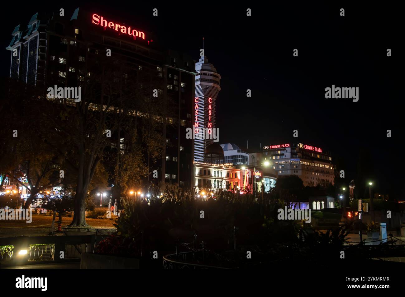 Sheraton, Casino and Crowne Plaza signs at night in Niagara Falls, Ontario, Canada Stock Photo