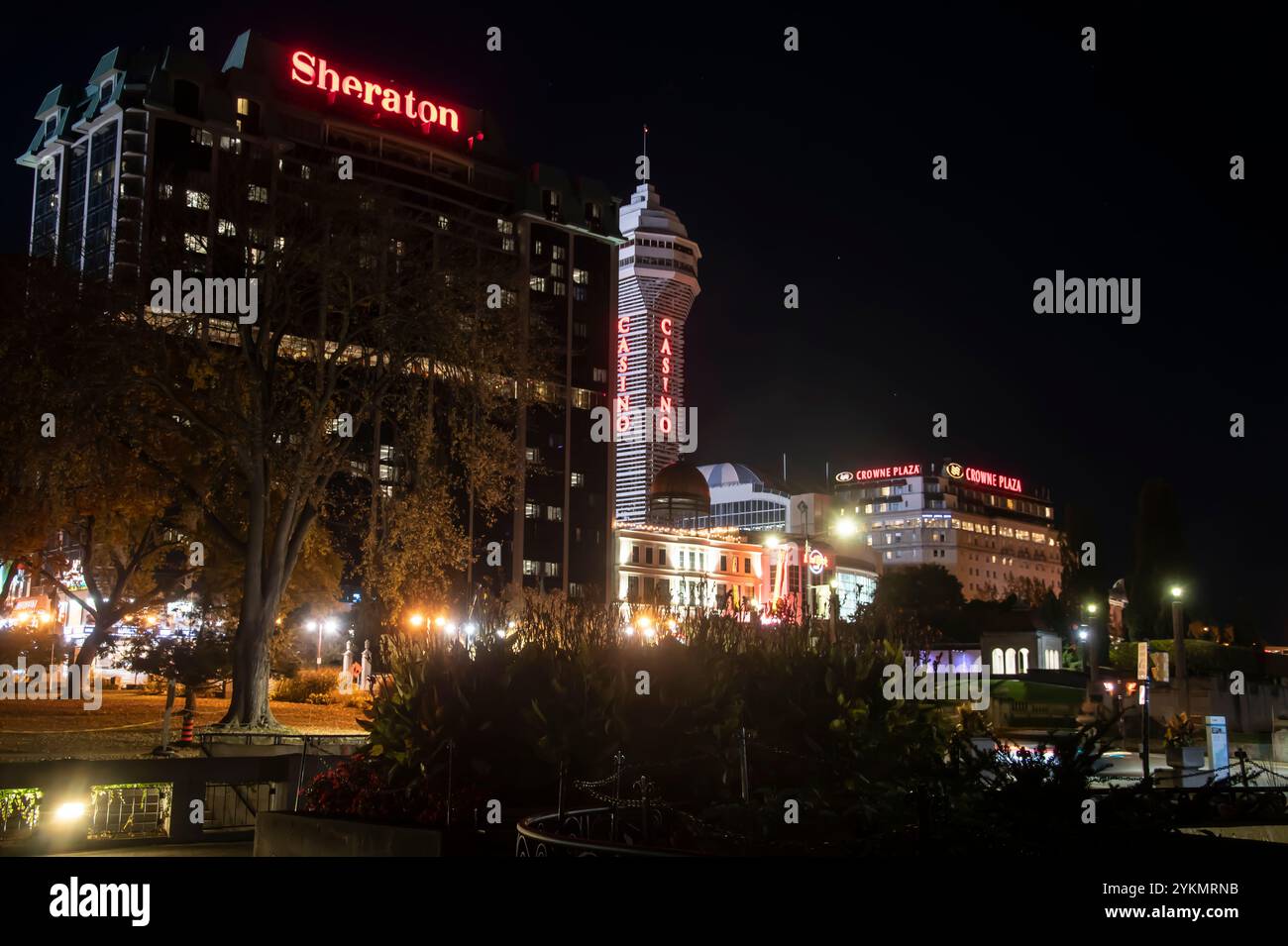 Sheraton, Casino and Crowne Plaza signs at night in Niagara Falls, Ontario, Canada Stock Photo