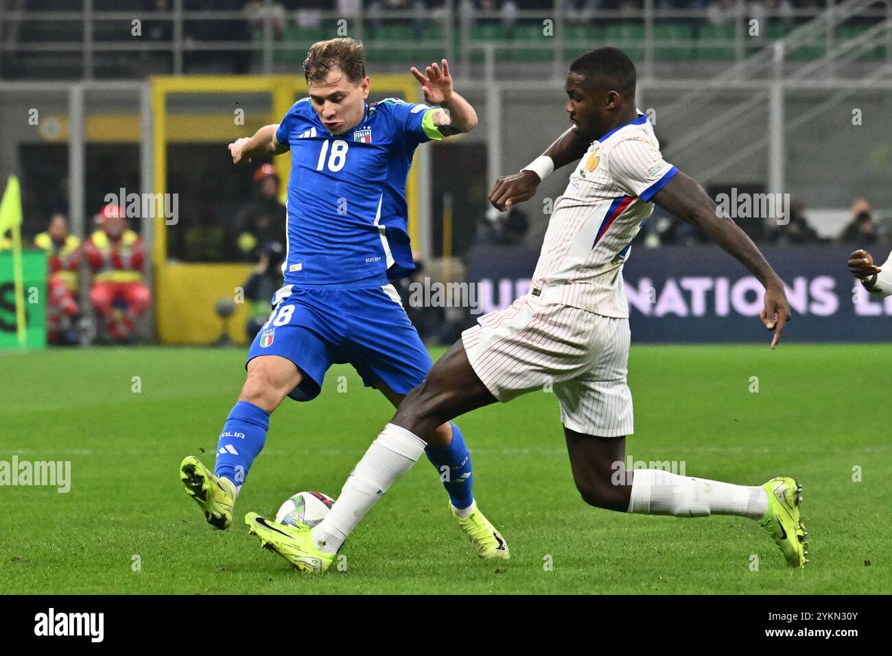 Nicolò Barella (ITA) and William Saliba (FRA) in action during the UEFA Nations League Matchday 6 match between Italy and FRance at the San Siro Stadi Stock Photo
