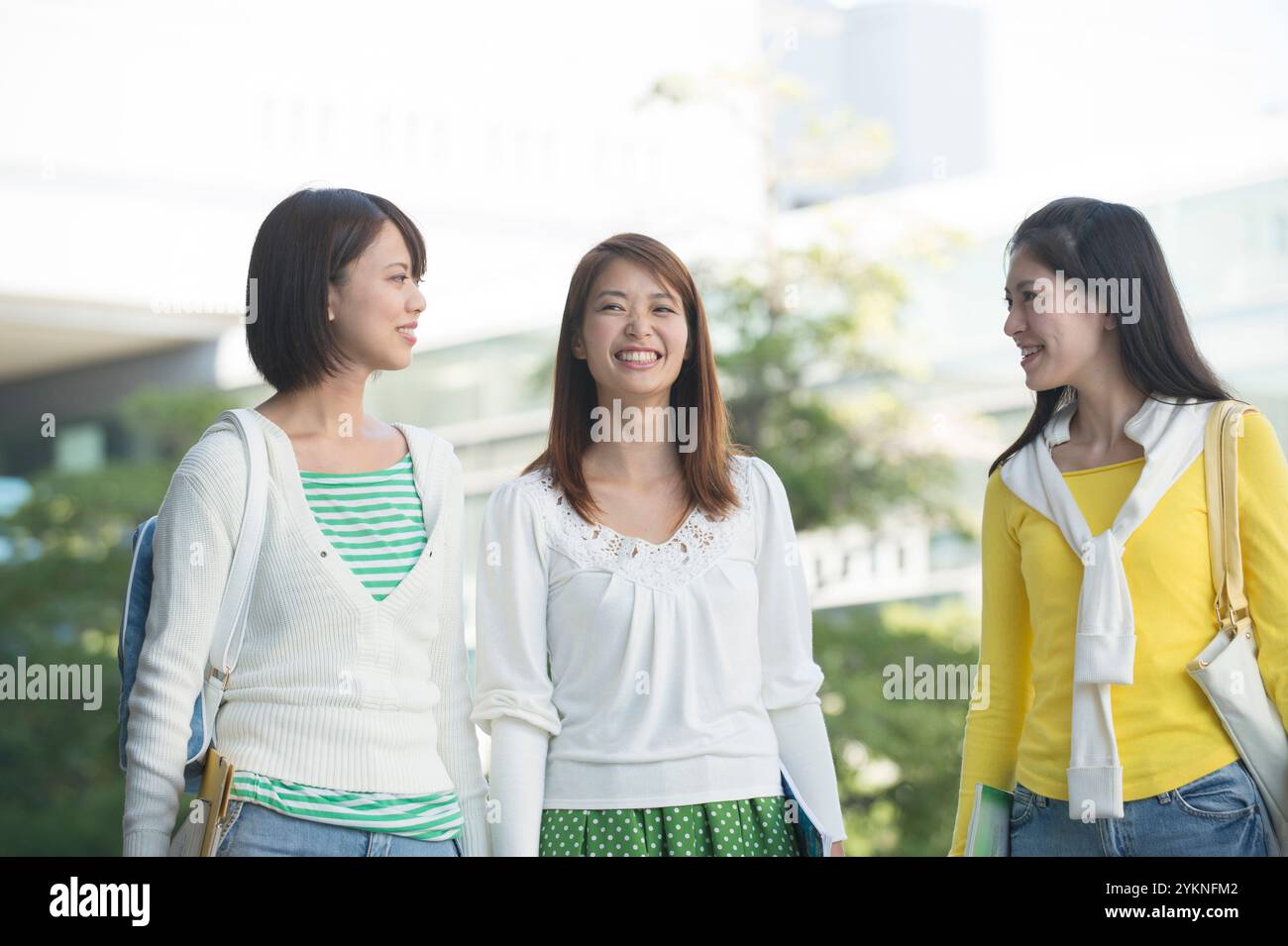 Three female university students walking on campus Stock Photo - Alamy