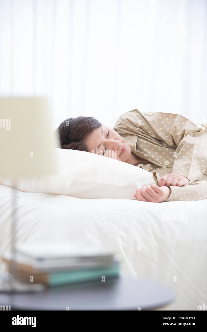 Mature woman in bed hi-res stock photography and images - Alamy