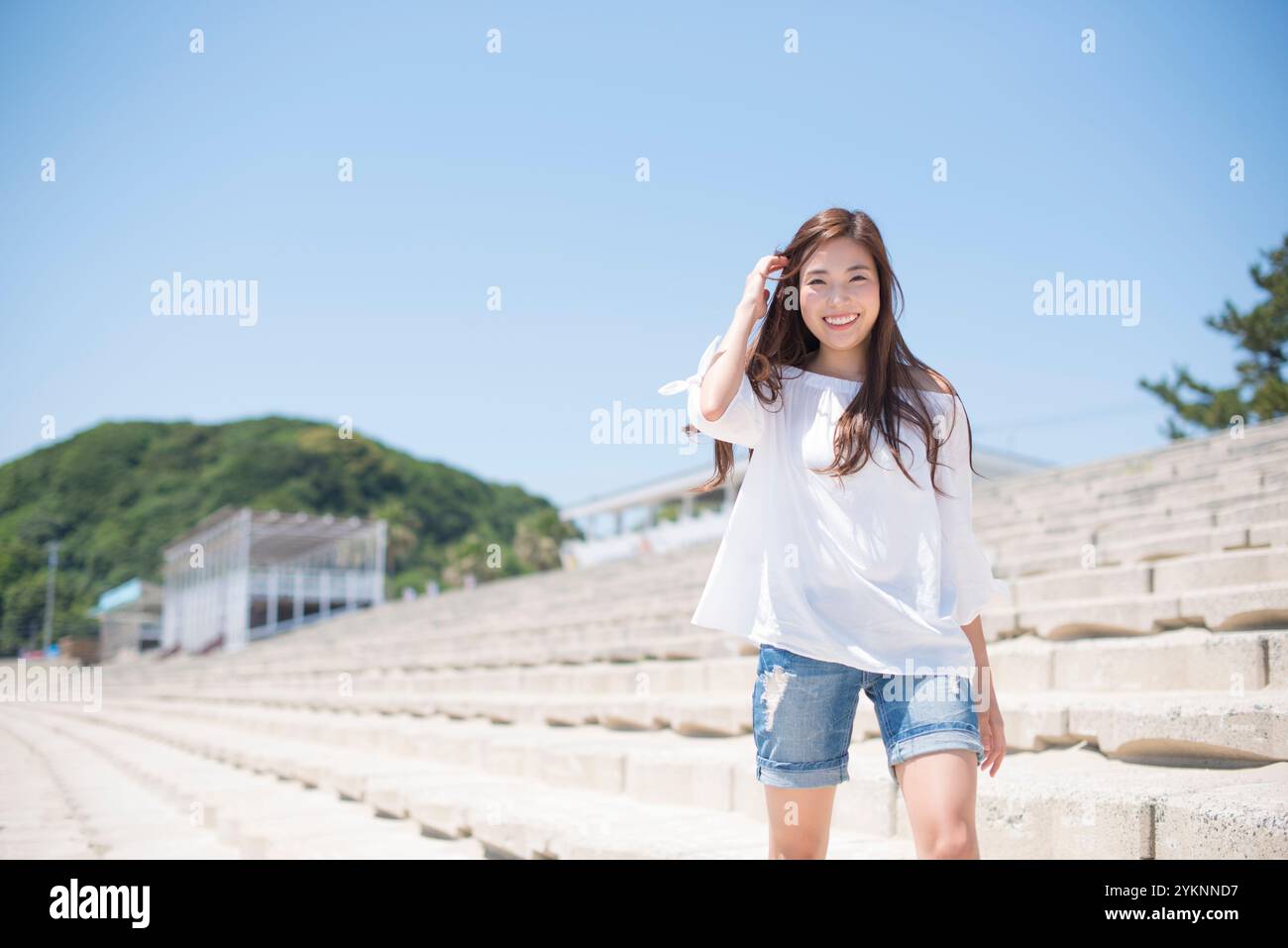 Woman walking by sea hi-res stock photography and images - Alamy