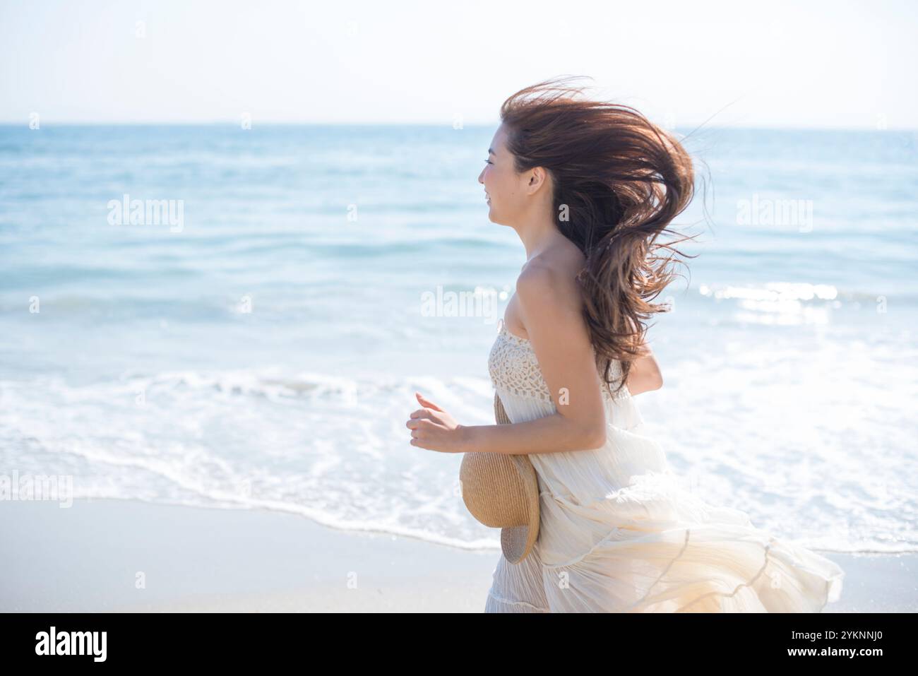 Woman walking barefoot on sea sand beach Stock Photo - Alamy