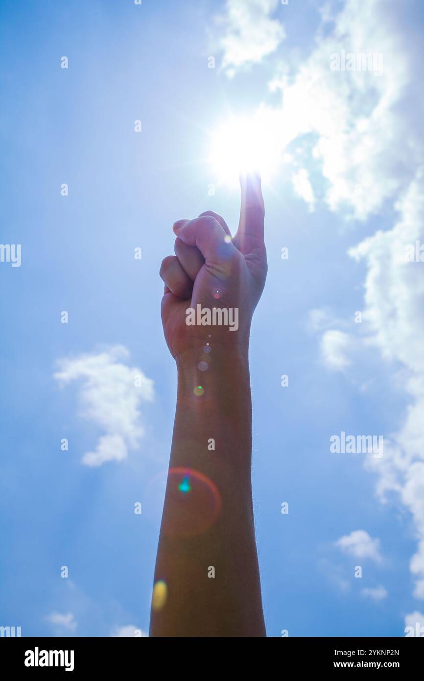 Blue sky, sun and outstretched hands Stock Photo - Alamy