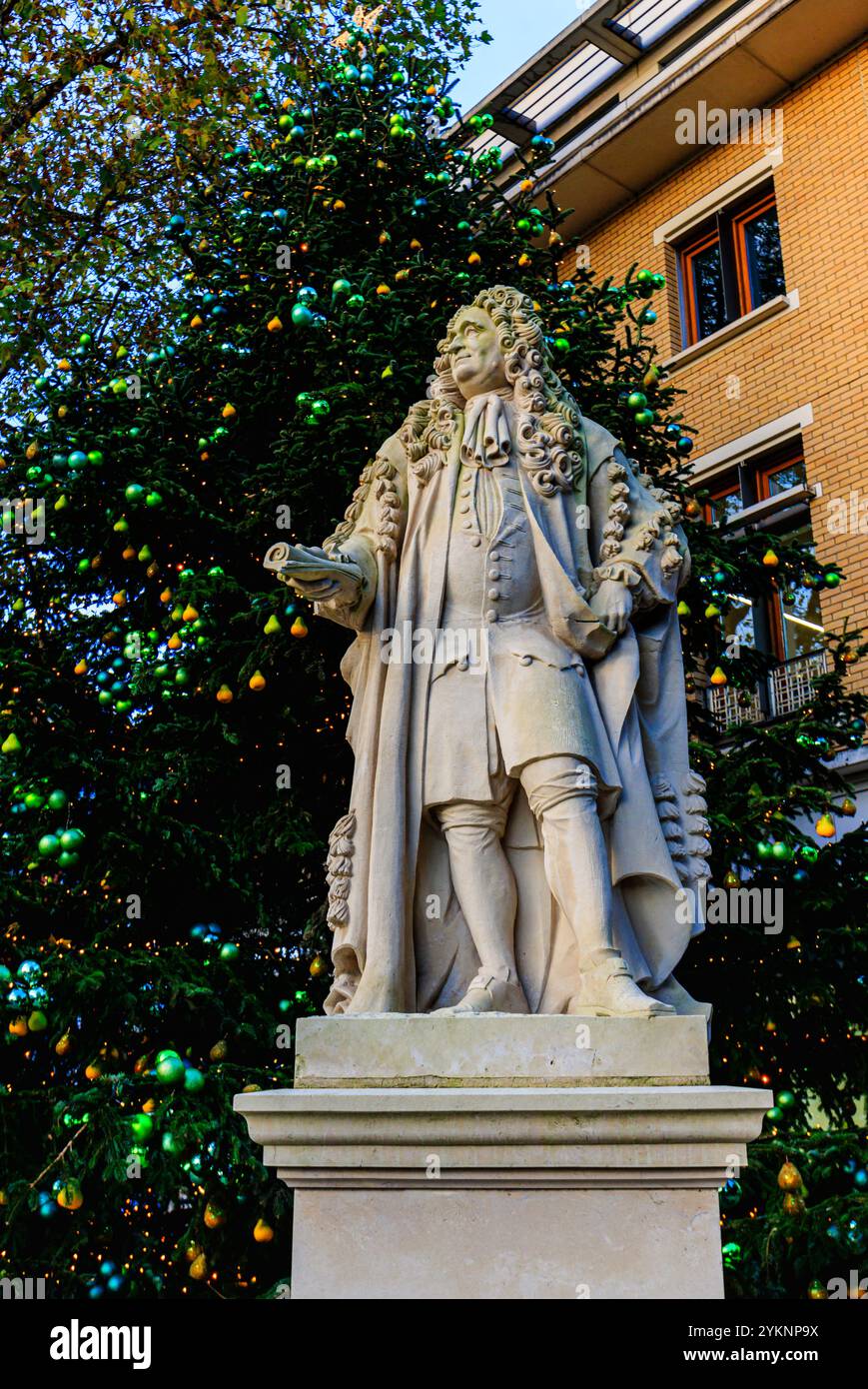Statue of Sir Hans Sloane in front of a Christmas Tree in Duke of York Square off the Kings Road in Kensington and Chelsea, London Stock Photo