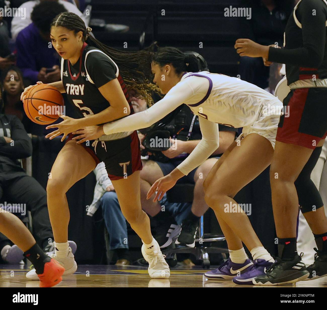 Baton Rouge, United States. 18th Nov, 2024. Troy Trojans forward Zay Dyer (5) tries to get past LSU Lady Tigers forward Jersey Wolfenbarger (8) during a women's basketball game at the Pete Maravich Assembly Center on Monday, November 18, 2024 in Baton Rouge, Louisiana. (Photo by Peter G. Forest/SipaUSA) Credit: Sipa USA/Alamy Live News Stock Photo