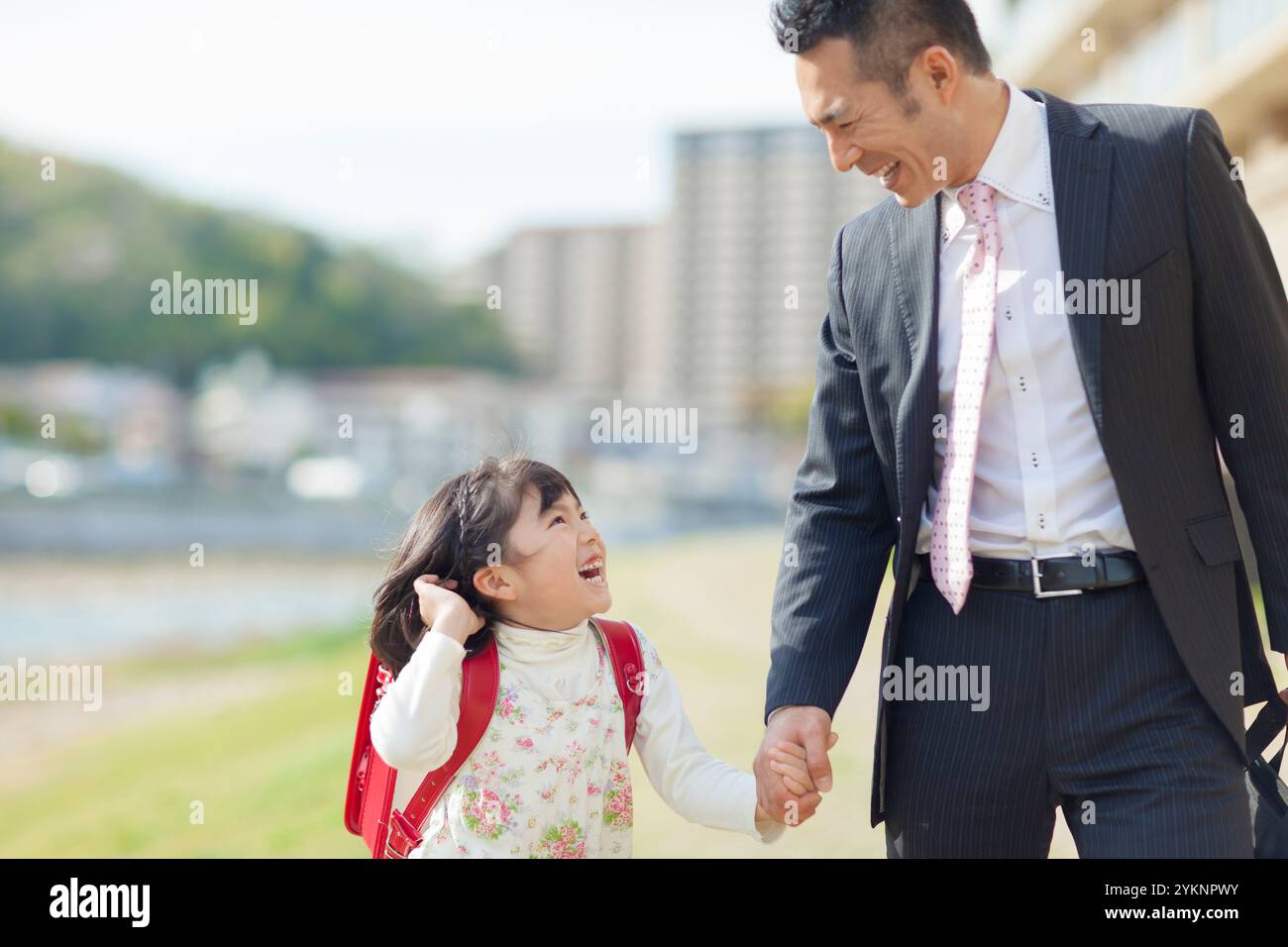 Father and daughter holding hands Stock Photo - Alamy