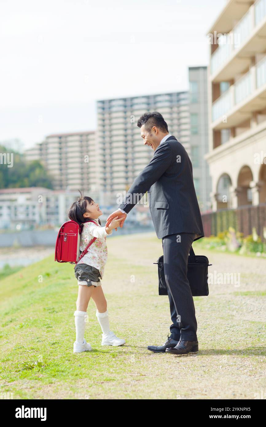 Father and daughter holding hands Stock Photo - Alamy