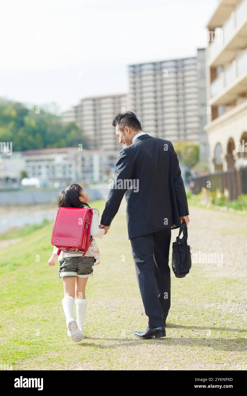 Father and daughter holding hands Stock Photo - Alamy