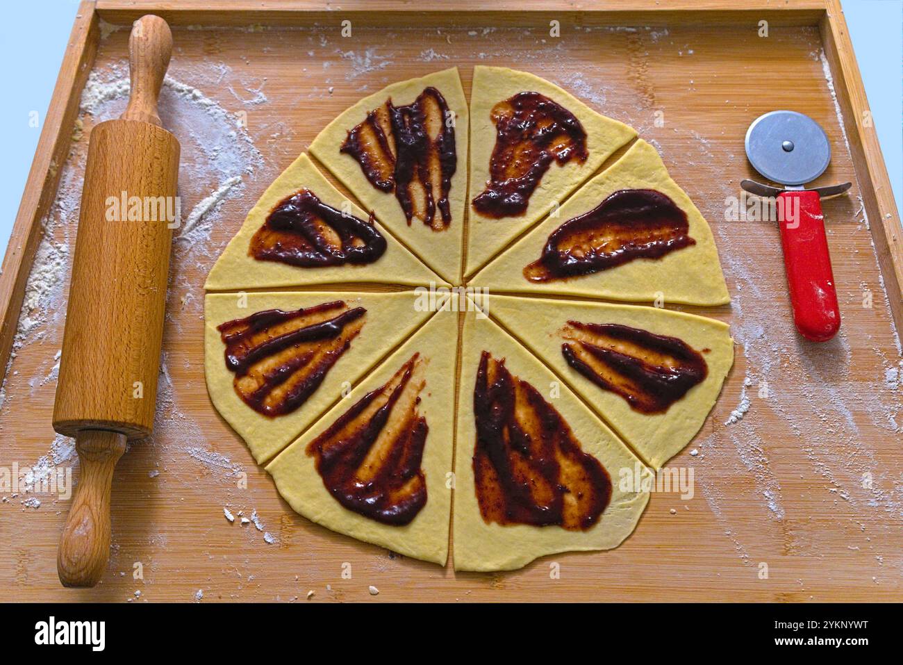 Preparing Fruit-Filled Croissants Stock Photo