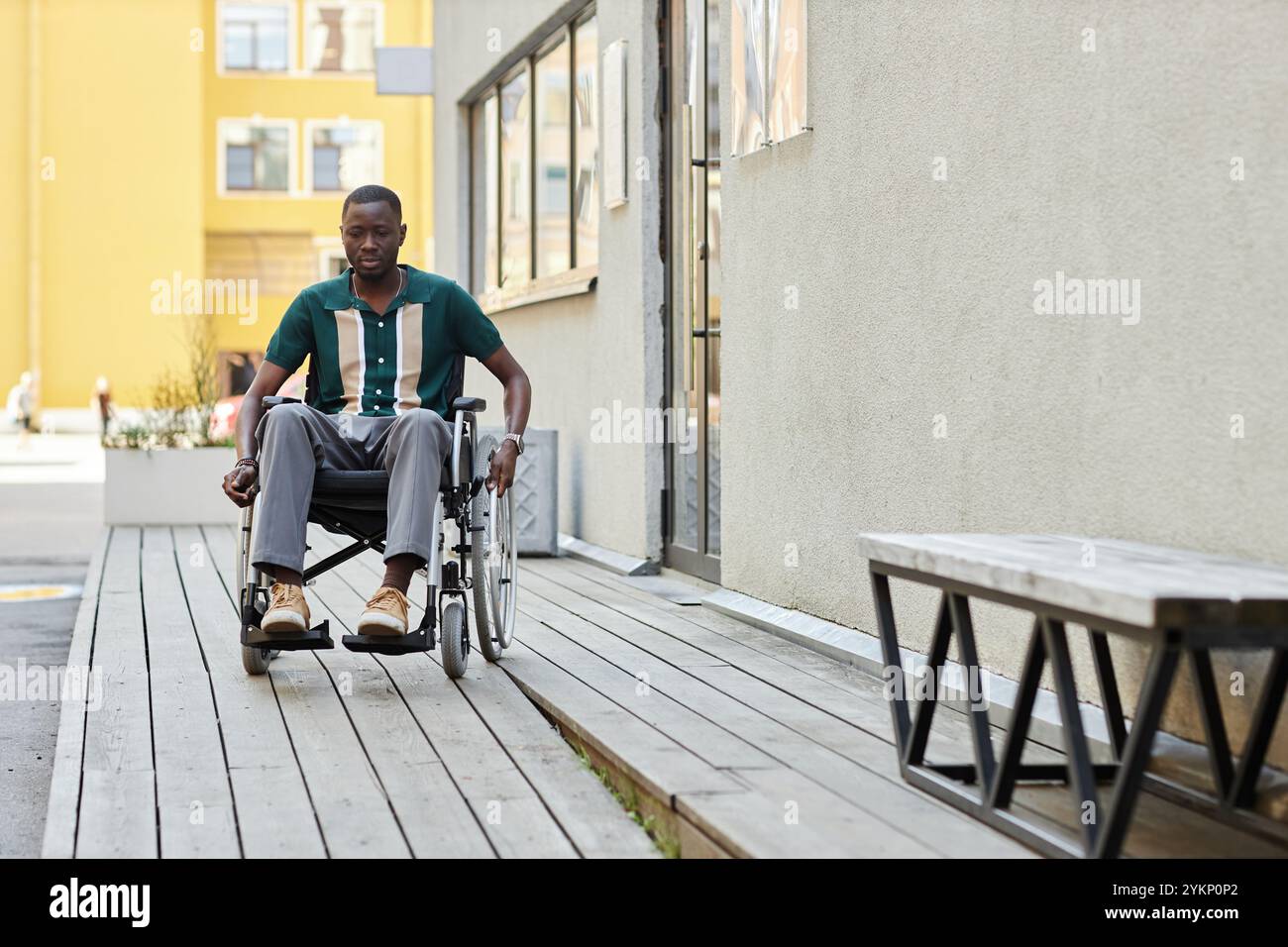 Someone Using A Ramp Full length portrait of adult African American man using ramp in ...