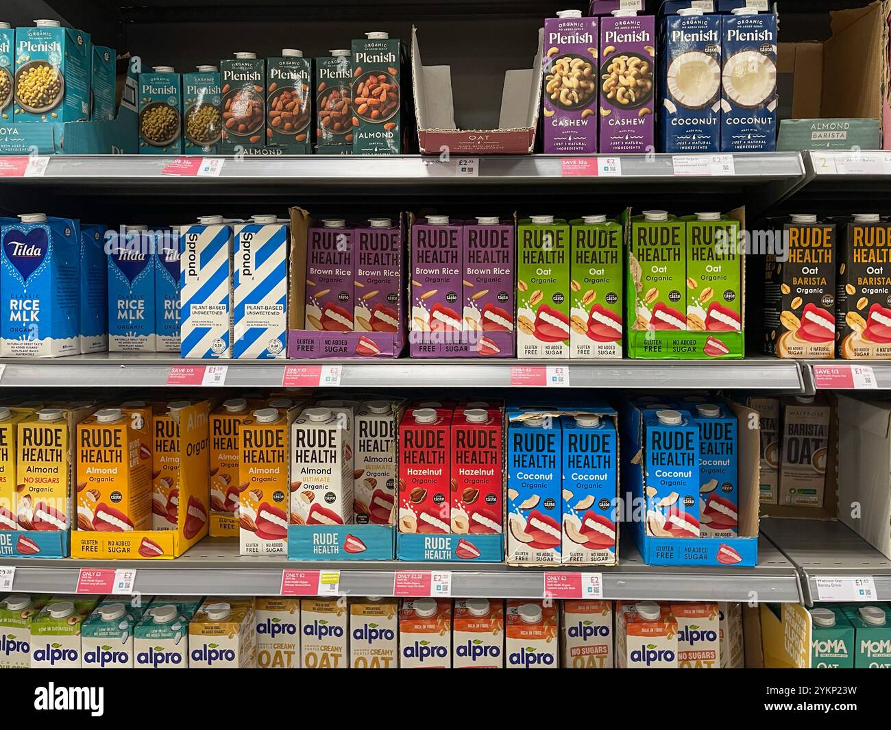 Oat milk goods on display at a Waitrose Supermarket - Smartphone Captured Stock Image
