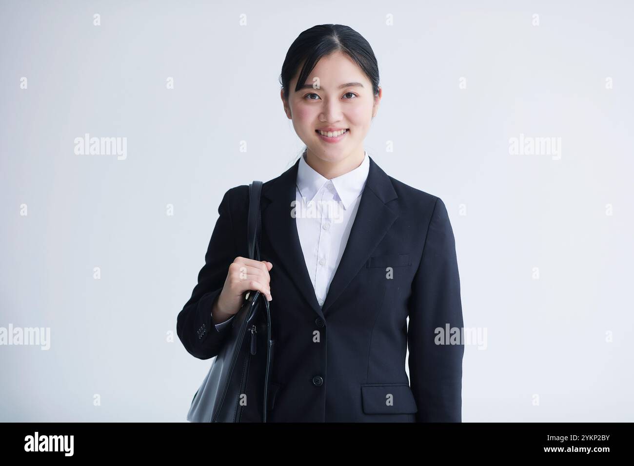 Young woman in a black suit hi-res stock photography and images - Alamy